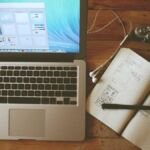 Laptop and notebook with a pen