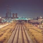 Railway tracks at night in a city